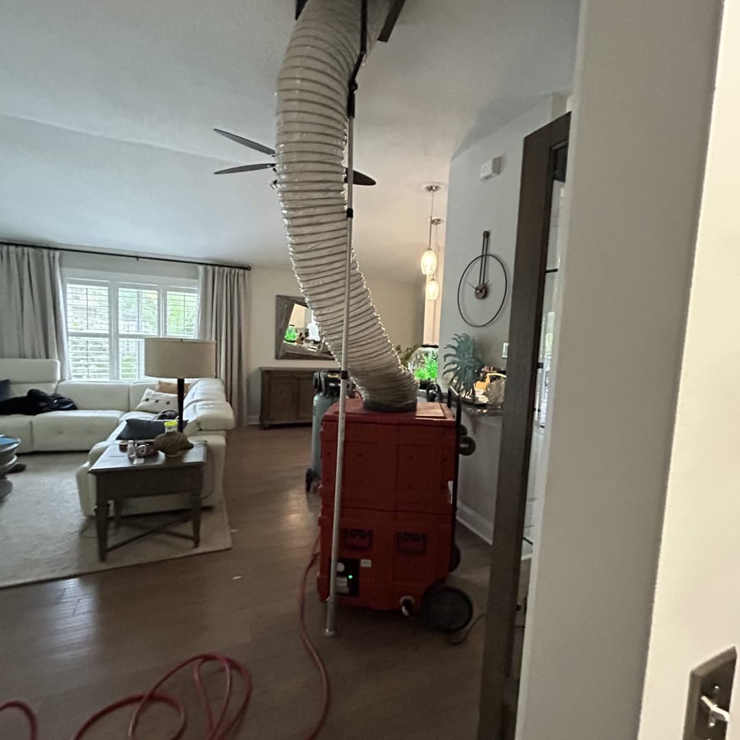 Source removal process - technician working on air ducts